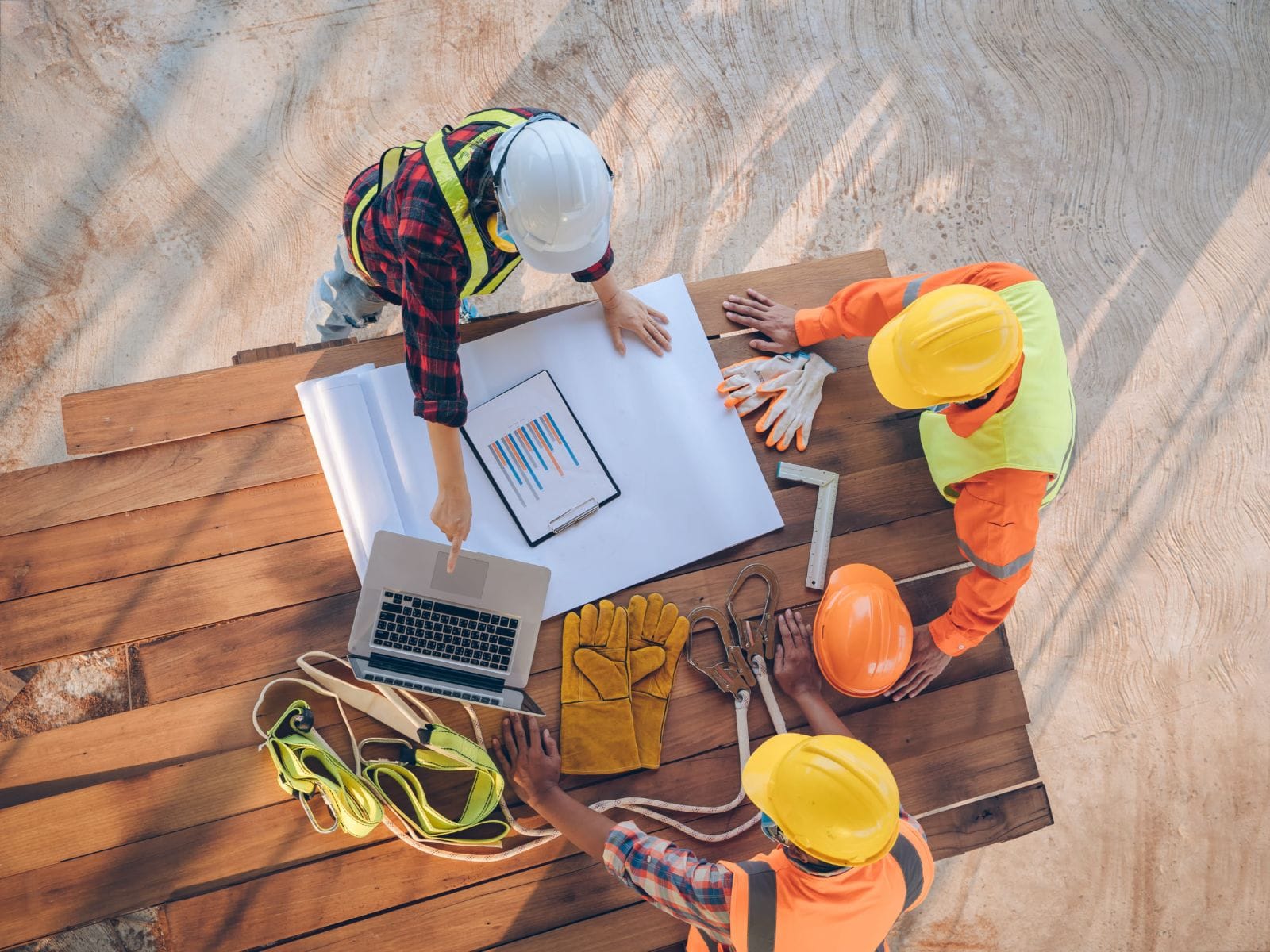 Owner’s representative consulting with construction team to manage project effectively.