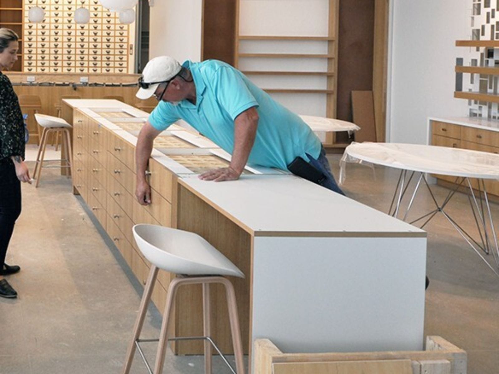 Team checking punch list and completing final touches in a retail interior space.